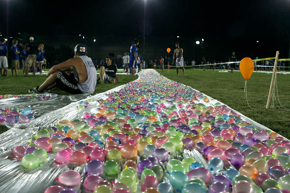 Waterballoons+were+lined+up+in+the+Johnson+Center+fields+in+preparation+for+the+waterballoon+fight+last+night+that+broke+the+world+record+for+most+number+of+waterballoons.+CSF+filled+55%2C+000+balloons%2C+which+broke+the+record+Bill+Gates+has+previously+set.