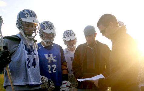 UK men's lacrosse coach Jacob Knight, right, goes over the remainder of the schedule with part of the team at practice on Nov. 13. Kristin Sherrard