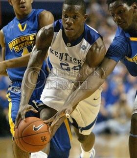Kentucky guard Eric Bledsoe dribbles through Morehead States defense during the first half of the basketball game at Rupp Arena Friday night. Bledsoe lead the Cats to their 75-59 victory over the Eagles.
 Photo by Zach Brake