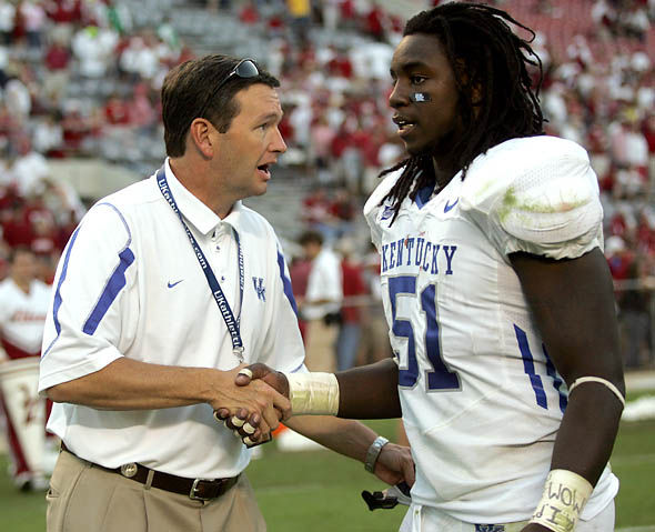 Allie Garza//Kentucky Kernel
 UK Athletics director Mitch Barnhart shakes senior linebacker Johnny Williams hand after Alabama defeated Kentucky 17-14 on Saturday.