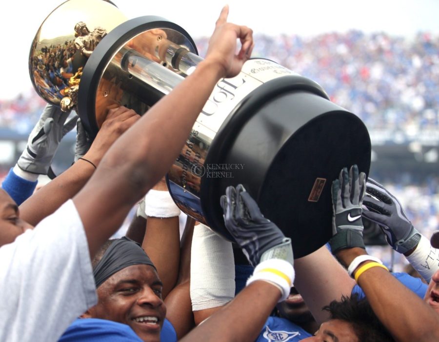 UK+receives+the+Governors+Cup+Trophy+after+their+31-27+win+over+Louisville+on+Saturday%2C+Sept.+19%2C+2009.+Photo+by+Britney+McIntosh