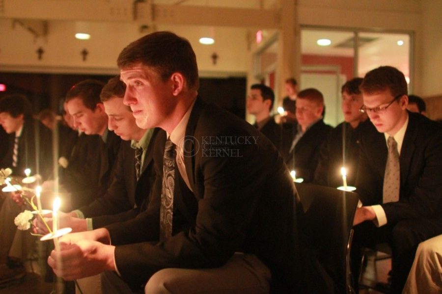 A Delta Sigma Phi fraternity brother cries during the Candlelight Vigil for Alex Ehr in the Newman Center in Lexington, Ky., on 2/23/12. Photo by Brandon Goodwin