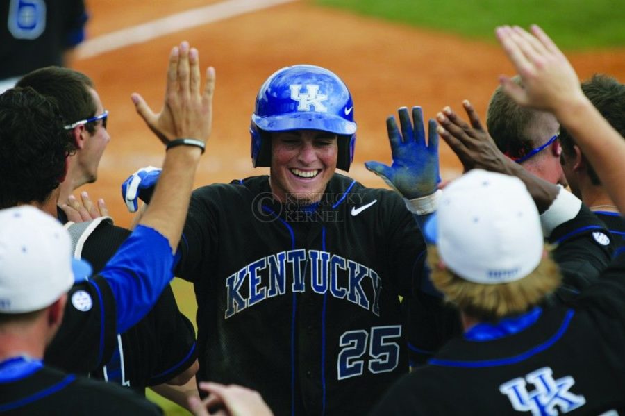 Infielder+Thomas+McCarthy+high-fives+teammates+after+scoring+during+the+final+game+of+the+UK+vs.+South+Carolina+series+in+Lexington%2C+Ky.%2C+on+3%2F18%2F12.+Photo+by+Brandon+Goodwin