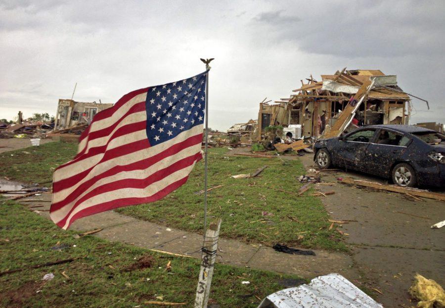 An+American+flag+flaps+in+the+wind+near+Plaza+Towers+Elementary+School%2C+Tuesday%2C+May+21%2C+2013%2C+in+Moore%2C+Oklahoma%2C+after+yesterdays+tornado+that+rolled+through+the+Oklahoma+City+area%2C+injuring+scores+and+killing+at+least+two+dozen+people.+%28Brad+Loper%2FDallas+Morning+News%2FMCT%29