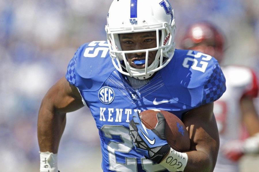 UK+running+back+Jonathan+George+runs+the+ball+down+the+field+to+score+a+touchdown+during+the+first+half+of+the+UK+vs.+Miami%28Ohio%29+football+game+at+Commonwealth+Stadium+in+Lexington%2C+Ky.%2C+on+Saturday%2C+September+7%2C+2013.+UK+won+its+first+home+game+of+the+season+41-7.+Photo+by+Tessa+Lighty