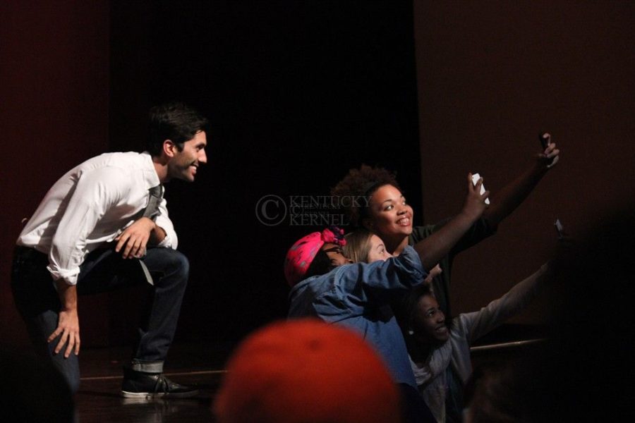 Nev Schulman, host of the MTV show Catfish, lets a few lucky fans take photos with him on stage at the Singletary Center for the SAB sponsored Behind The Lens event. Lexington, Ky., on Tuesday, October 8, 2013. Photo by Marcus Dorsey