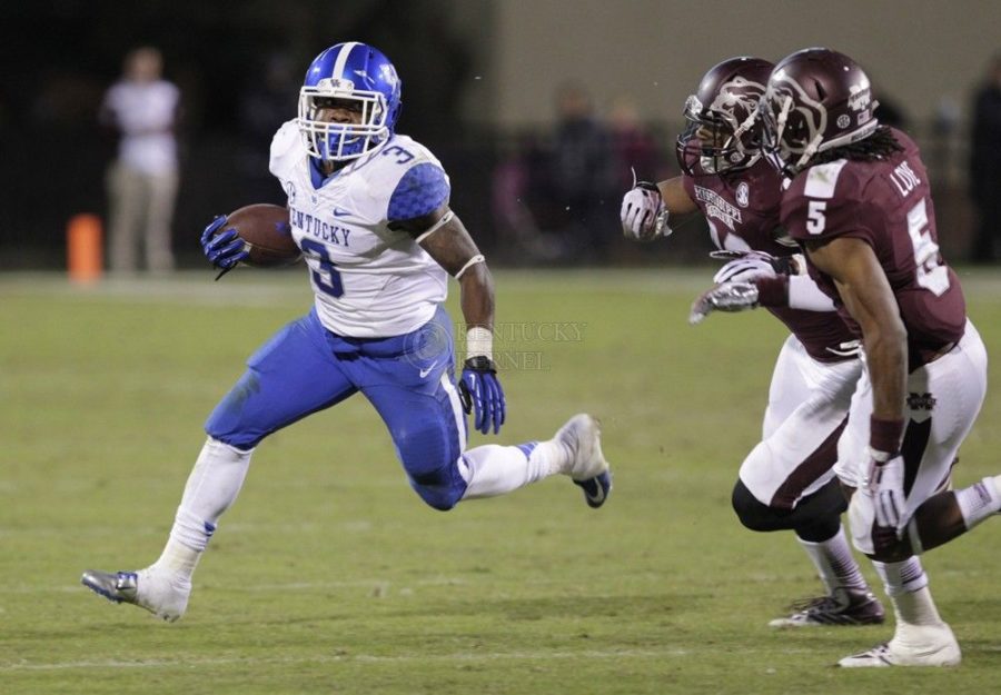 Kentucky's Jojo Kemp (3) evades the Mississippi defense in the fourth quarter at Davis Wade Stadium in Starkville, Mississippi, on Thursday, October 24, 2013. Mississippi State defeated Kentucky, 28-22. (Pablo Alcala/Lexington Herald-Leader/MCT)