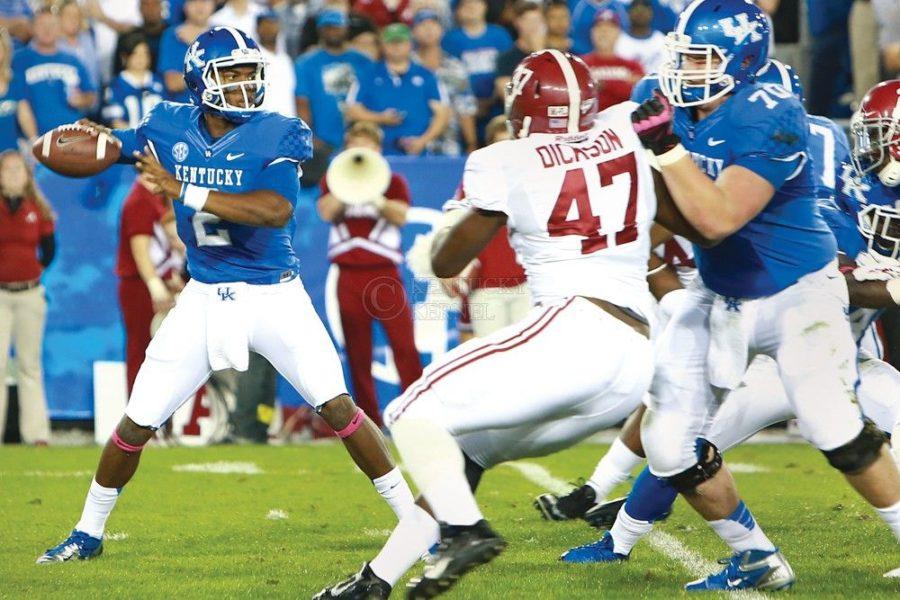 Kentucky+quarterback+Jalen+Whitlow+%282%29+passing+the+ball+during+the+first+half+of+the+UK+football+game+against+Alabama+at+Commonwealth+Stadium+on+Saturday%2C+October+12%2C+2013%2C+in+Lexington%2C+Ky.+Photo+by+Kalyn+Bradford