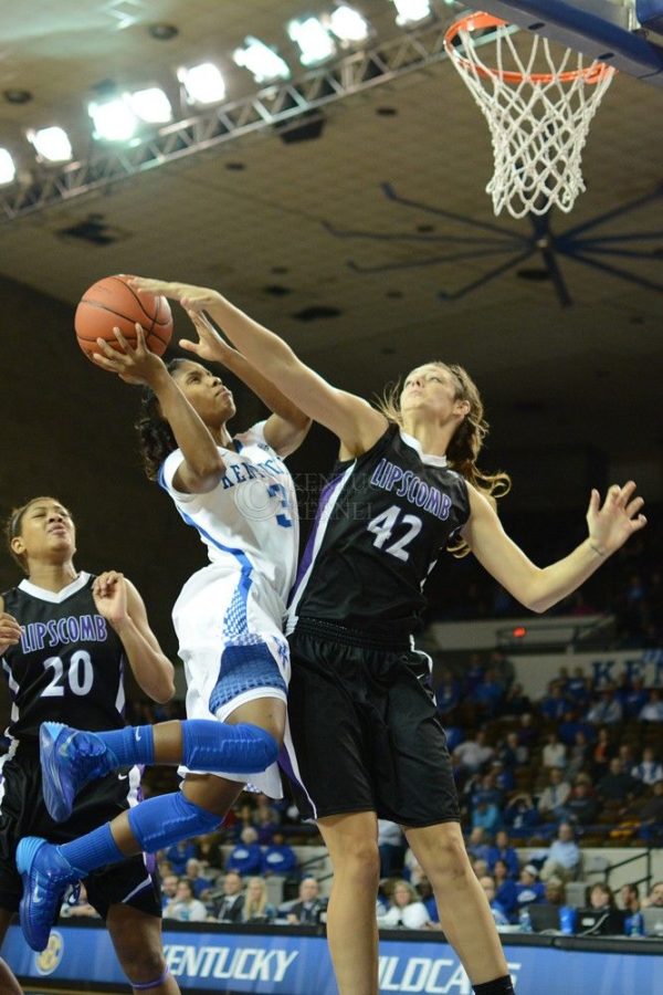 Kentucky Wildcats guard Janee Thompson (3) shoots the ball while Lipscomb Lady Bisons center Jess Reece (42) guards the basket during the second half of the UK Women's Basketball game versus Lipscomb at Memorial Coliseum in Lexington, Ky., on Thursday, November 21, 2013. Photo by Caleb Gregg