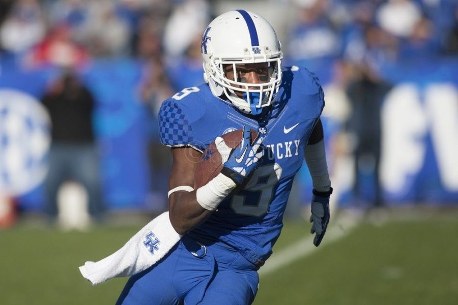 Kentucky Wildcats wide receiver Demarco Robinson (9) runs for yards during the second half of the University of Kentucky vs. Missouri University football game at Commonwealth Stadium in Lexington, Ky., on Saturday, November 9, 2013. Missouri defeated Kentucky 48-17. Photo by Michael Reaves