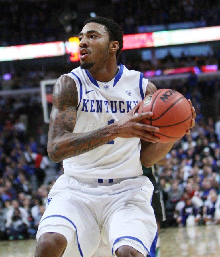 Kentucky+Wildcats+guard+James+Young+%281%29+saves+the+ball+during+the+first+half+of+UK+mens+basketball+vs.+Michigan+State+at+Rupp+Arena+in+Chicago%2C+Ill.%2C+at+the+Champions+Classic+on+Tuesday%2C+November+12%2C+2013.+Photo+by+Emily+Wuetcher