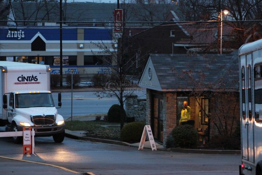 Ed+Dailey+points+a+truck+toward+its+destination+at+gate+no.+1+in+Lexington+Ky.%2C+on+Friday+December+06%2C+2013.+Photo+by+Judah+Taylor