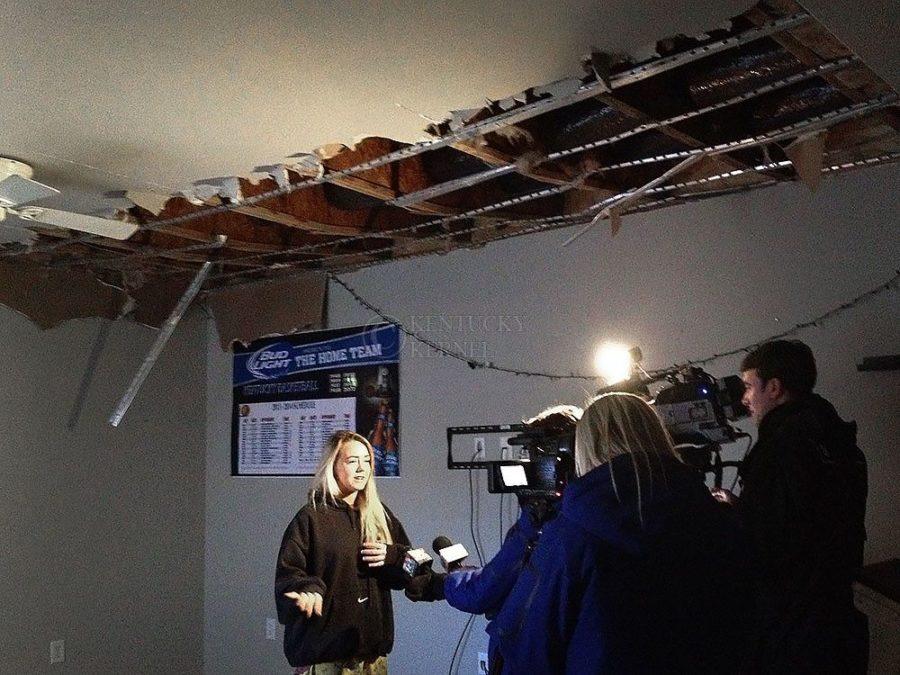 Anna Simon, sophomore, talks with WKYT and LEX 18 reporters inside her apartment, and under her caved in ceiling, at The Lex in Lexington, Ky., on Sunday, January 19, 2014. Photo by Eleanor Hasken