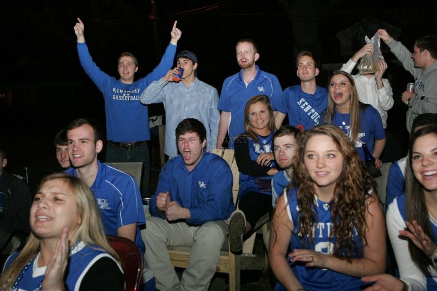 Students celebrate as Kentucky scores during the first half on University Street in Lexington, Ky., on Friday, March 28, 2014. Photo by Adam Pennavaria