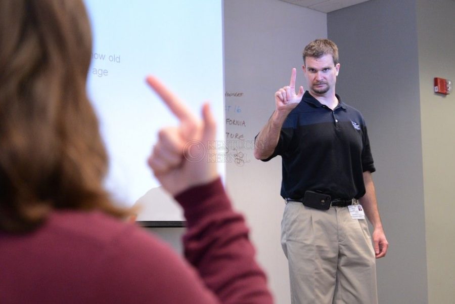 Anthony Isaacs signs to his class during a American Sign Language course in Lexington, Ky., on Monday, March 24, 2014. Photo by Eleanor Hasken