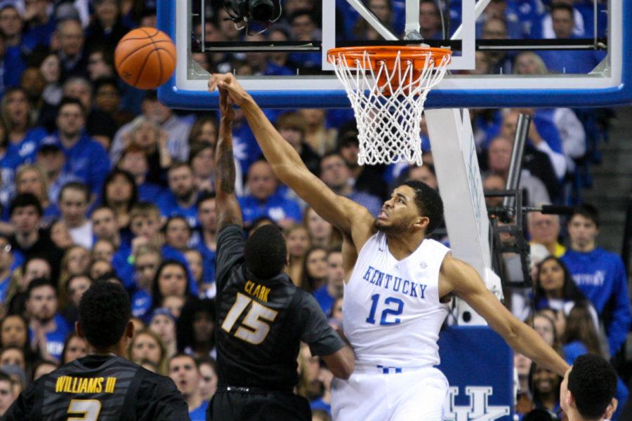 UK forward Karl-Anthony Towns rejects the shot of Missouri guard Wes Clark (#15) during the first half of the University of Kentucky versus University of Missouri men's basketball game at Rupp Arena in Lexington, Ky., on Tuesday, January 13, 2015. Photo by Cameron Sadler