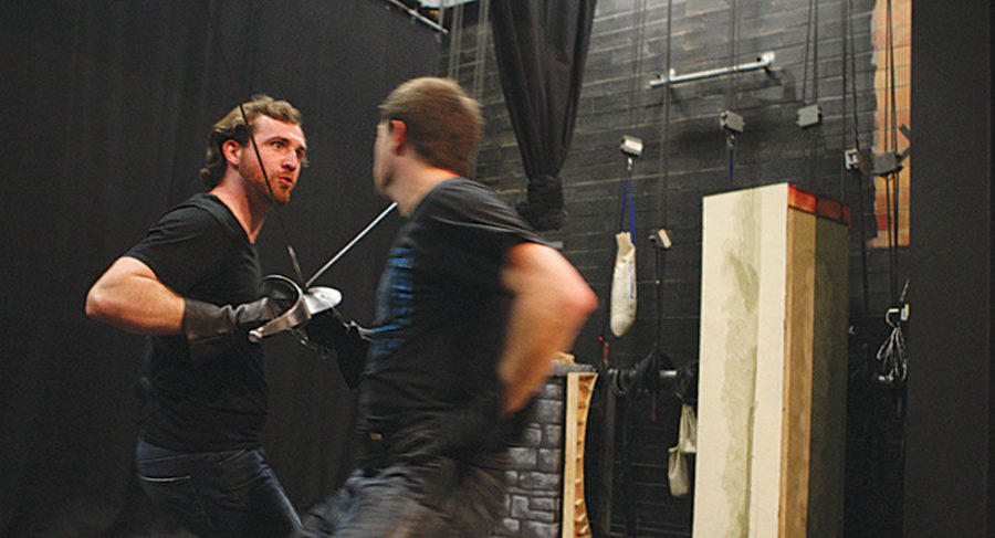 Theater+graduates+David+Theaker+%28left%29+and+David+Alan+Clark+duel+onstage+with+swords+during+Andrew+Rays+stage+combat+class+at+the+Briggs+Theater+on+Wednesday%2C+February+25%2C+2015+in+Lexington%2C+Ky.+Photo+by+Adam+Pennavaria