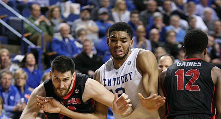 Kentucky forward, Karl-Anthony Towns (12) fights through two Georgia players during the second half of the UK verses University of Georgia men's basketball game. UK defeats Georgia 69-58 Tuesday, February 3, 2015 in Lexington. Photo by Joel Repoley