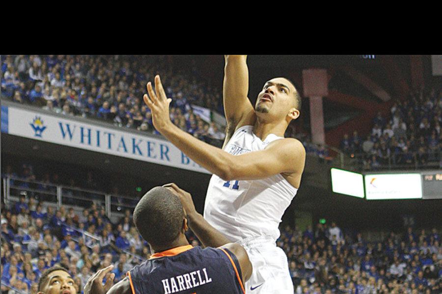 UK forward Trey Lyles (41) leaps over Auburn guard Kt Harrell (1) in scoring a point for his team during the first half of the UK men's basketball game against Auburn in Rupp Arena on Saturday, February 21, 2015. UK leads 52 to 26 at halftime. Photo by Marcus Dorsey