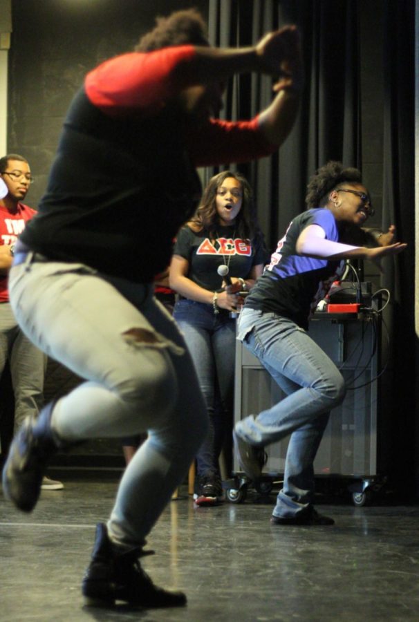 Members of UK sorority Delta Sigma Theta perform their step routine on Center Theatre stage during the UK Stepping Through the Decades event in the Student Center on, Feb. 8, 2015. Photo by Marcus Dorsey | Staff