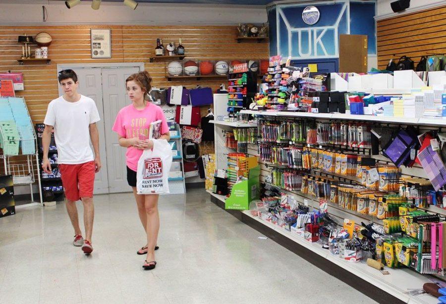 Freshman business major, Jesse Hart, and Sophomore marketing major, Sarah Miller, browse the new school supply section in Kennedys Bookstore in Lexington, Ky. on Tuesday, April 27, 2013.