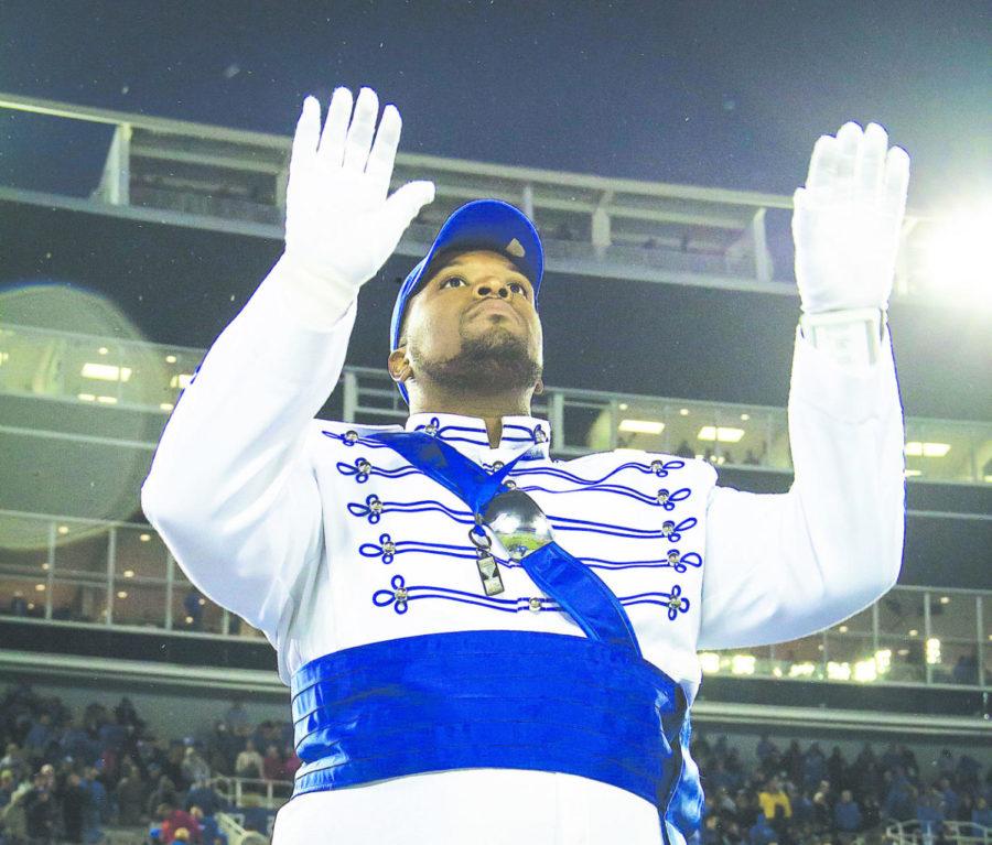 Dee Walker is UK’s first African-American drum major. He will graduate in May with a degree in choral music education. 