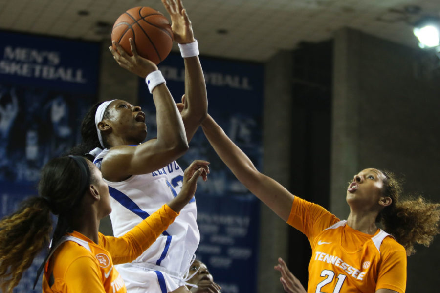 Junior forward Evelyn Akhator (13) shoots the ball over a defender during the game against the Tennessee Volunteers on Monday, January 25, 2016 in Lexington, Ky. Kentucky won the game 64-63. Photo by Hunter Mitchell | Staff