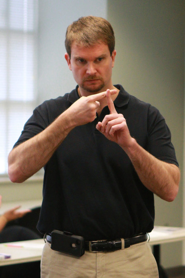 UK instructor Anthony Isaacs teaches during ASL class in Lexington, Ky. on Monday, February 22, 2016. Photo by Michael Reaves | Staff.