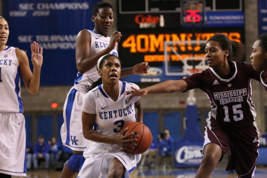 UK+freshman+point+guard+Janee+Thompson+barrels+past+Mississippi+State+junior+guard%2Fforward+Brittany+Young+at+Memorial+Coliseum+on+Thursday%2C+January+17%2C+2013+in+Lexington%2C+Ky.+Photo+by+Adam+Pennavaria+%7C+Staff
