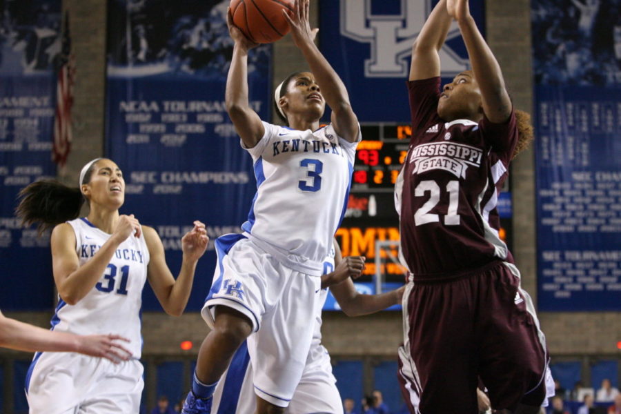 UK freshman point guard Janee Thompson leaps for a shot over Mississippi State sophomore guard Jerica James at Memorial Coliseum on Thursday, January 17, 2013 in Lexington, Ky. Photo by Adam Pennavaria | Staff