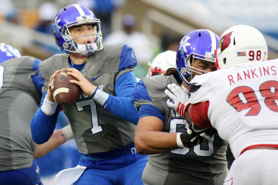 Kentucky quarterback Drew Barker looks for a open receiver during the game against the Louisville Cardinals at Commonwealth Stadium on Saturday, November 28, 2015 in Lexington, Ky. Louisville defeated Kentucky 38-24. Photo by Michael Reaves | Staff.