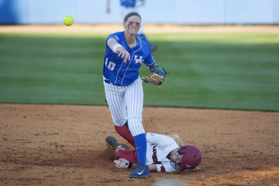 Shortstop Christian Stokes turns a double play during the game between the University of Kentucky softball team vs. University of Arkansas at John Cropp Stadium in Lexington, Ky.,on Saturday, April 19, 2014. Photo by Michael Reaves | Staff 