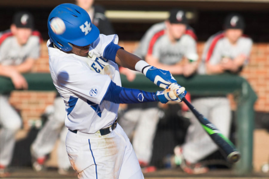 Junior infielder Javon Shelby (5) hits the ball during the game against the Cincinnati Bearcats on Tuesday, March 8, 2016 in Lexington, Ky. Kentucky won the game 8-4. Photo by Hunter Mitchell | Staff