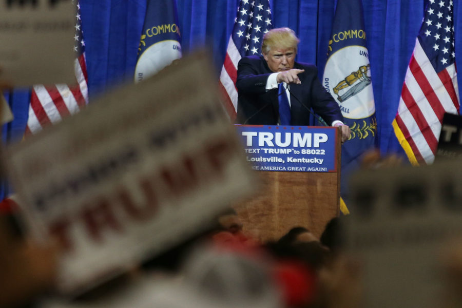 Republican presidential candidate Donald Trump points at a protestor and tells the crowd get him out during a rally at the Kentucky International Convention Center in Louisville, Ky. on Tuesday, March 1, 2016. Photo by Michael Reaves | Staff.