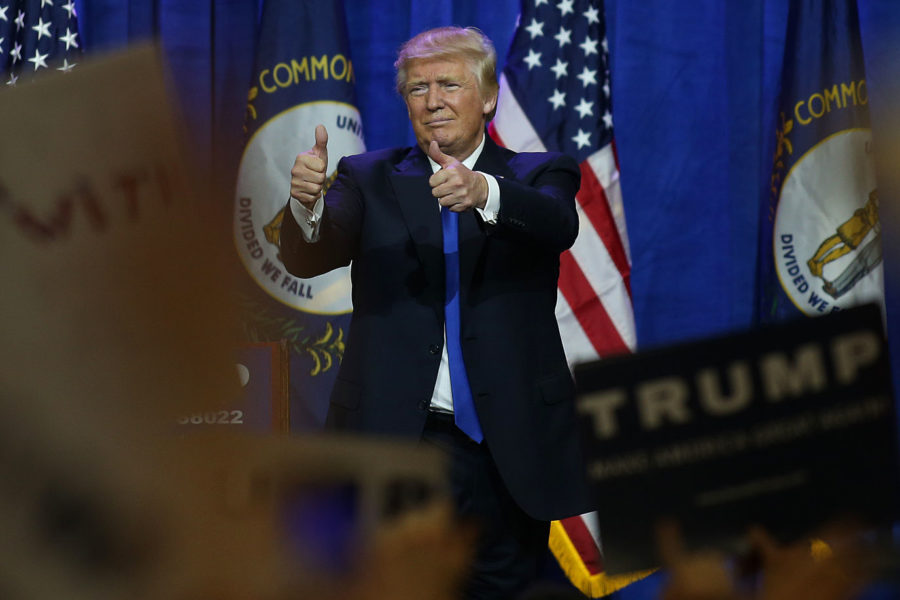 Republican presidential candidate Donald Trump waves goodbye to the crowd during a rally at the Kentucky International Convention Center in Louisville, Ky. on Tuesday, March 1, 2016. Photo by Michael Reaves | Staff.
