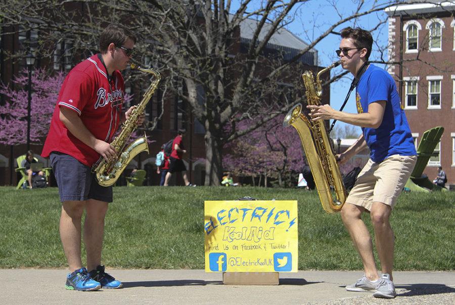 Jacob Slone and Jarad Sells of the band Electric Kool Aid play saxophone outside of Whitehall Classroom building. Thursday, April 14, 2016 in Lexington, Ky. Photo by Joel Repoley | Staff.