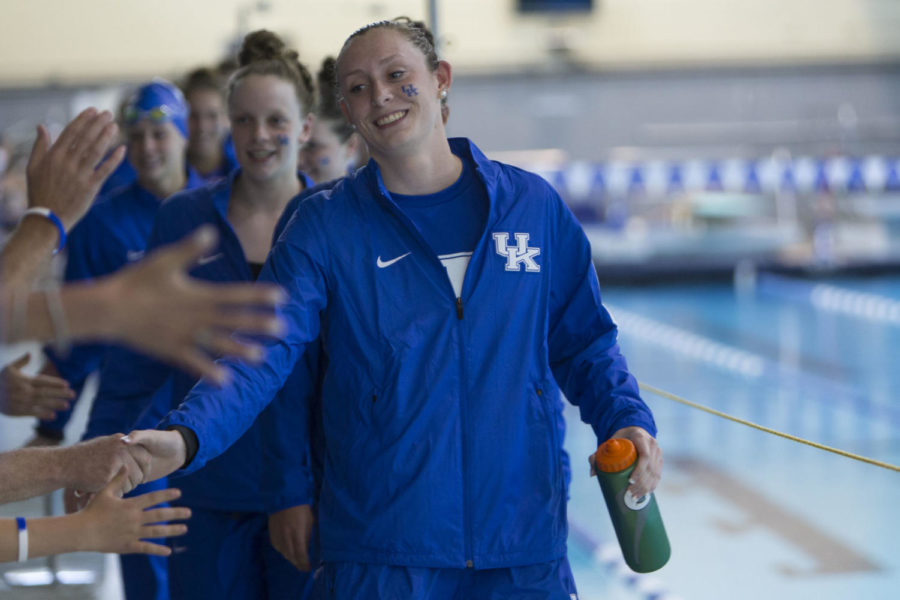 UK+signee+Madison+Winstead+high+fives+the+crowd+as+she+leads+the+blue+squad+out+to+the+pool+prior+to+the+UKs+Sun+Shall+Shine+Blue+and+White+meet+at+Lancaster+Aquatic+Center+in+%2C+Ky.+on+Friday%2C+April+22%2C+2016.+Winstead+was+granted+a+one-time+waiver+by+the+NCAA+to+swim+in+front+of+her+mother%2C+Shane+Winstead%2C+who+was+diagnosed+with+stage+four+colon+cancer+last+June.+Photo+by+Michael+Reaves+%7C+Staff.