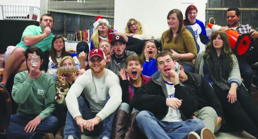 Members+of+the+2014-15+Kentucky+Kernel+staff+pose+for+a+picture+at+a+Christmas+party.+Former+photo+editor+Jonathan+Krueger+is+pictured+in+the+middle%2C+sporting+a+hat+and+holding+up+the+peace+sign.