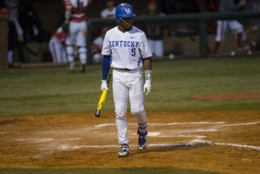 Third basemen Javon Shelby walks off the field after striking out with the bases loaded during the game against the Louisville Cardinals at Cliff Hagan Stadium in Lexington, Ky. on Wednesday, April 13, 2016. Photo by Michael Reaves | Staff.