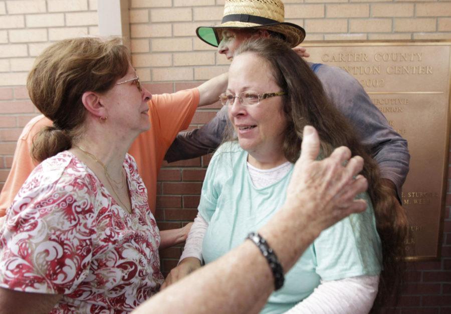 Kim Davis, center, and husband Joe Davis are greeted by relatives, including Kims mother Jean Bailey, left, outside the Carter County Detention Center in Grayson, Ky., on Tuesday, Sept. 8, 2015. (Pablo Alcala/Lexington Herald-Leader/TNS)