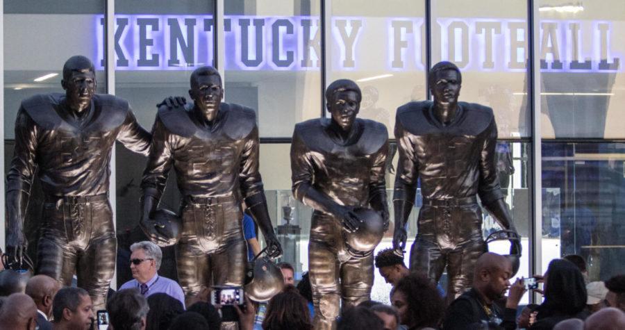 The statue honoring Nate Northington, Greg Page, Wilbur Hackett and Houston Hogg was unveiled outside of the new Football Training Facility on Thursday, September 22, 2016 in Lexington, Ky. photo by Addison Coffey | Staff