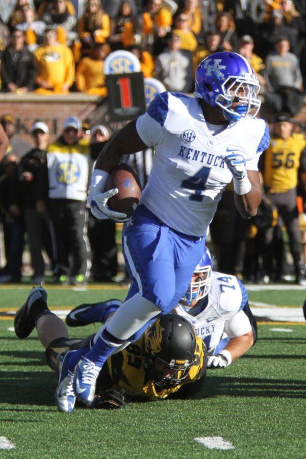Kentucky running back Mikel Horton runs the ball towards the first down during the first half of the University of Kentucky vs. Missouri football game at Faurot Field in Columbia, MO., on Saturday, November 1, 2014. Photo by Jonathan Krueger