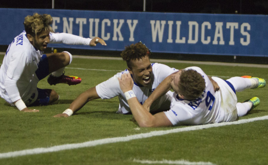 Kevin Barajas, Noah Hutchins, and Andrew Mckelvey celebrate the game winning goal in extra time during the game against Eastern Tennessee State on Wednesday, September 21, 2016 in Lexington, Ky. Kentucky won the match in extra time 1-0. Photo by Carter Gossett | Staff