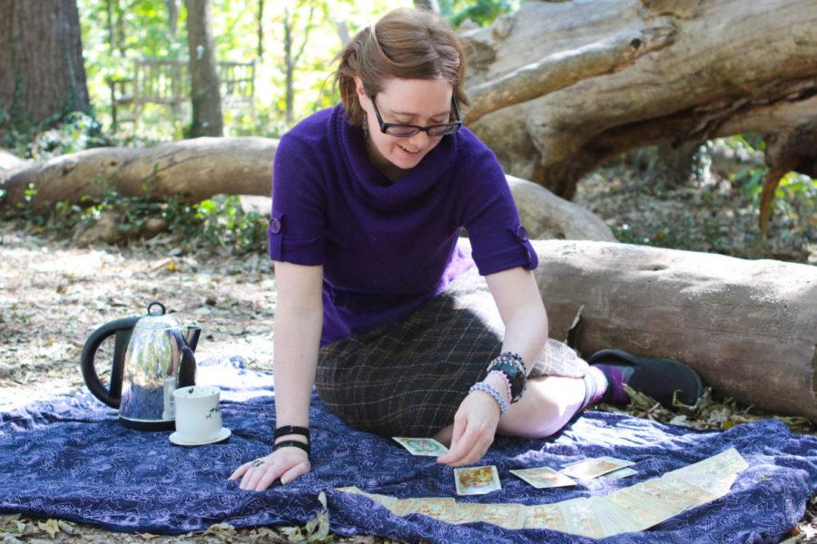 Tabitha Dial, 36, demonstrates a tarot card reading at University of Kentucky Arboretum on Sunday, October 9, 2016, in Lexington, Ky. She has been reading tarot cards and tea leaves professionally for four years. Photo by Joshua Qualls | Staff