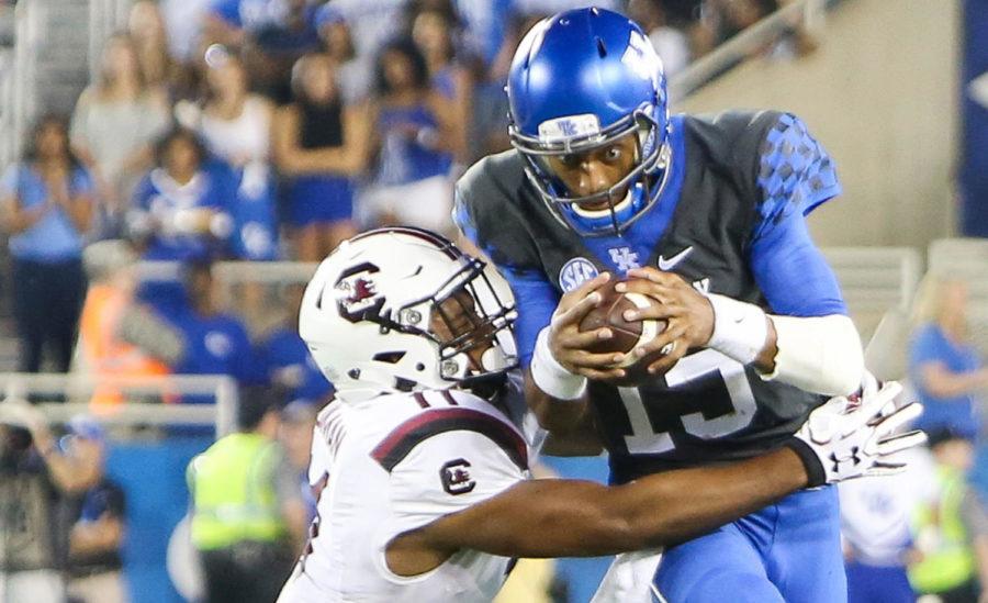 Kentucky quarterback Stephen Johnson drives the ball down the line before being tackled by South Carolina at Commonwealth Stadium on Saturday, September 24, 2016 in Lexington, Ky. Kentucky defeated South Carolina 17-10. Photo by Lydia Emeric | Staff 