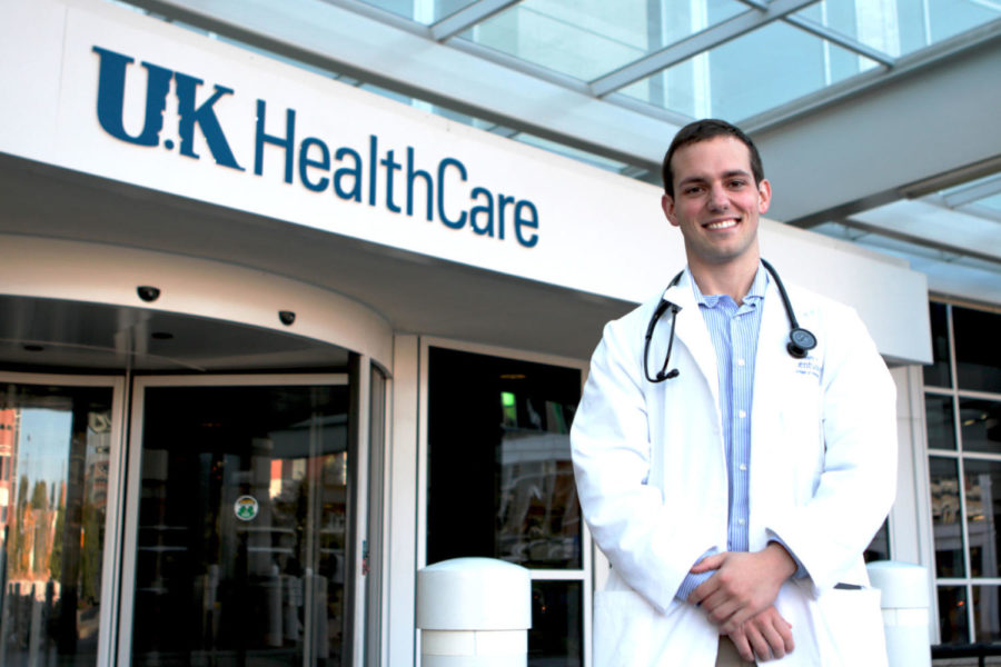 Third-year medical student Perry Hooper poses for a portrait at the entrance of the University of Kentuckys Albert B. Chandler Hospital on Sunday, October 16, 2016, in Lexington, Ky. Hooper took home four awards at UK College of Medicines annual Academic Convocation and Awards Day. Photo by Joshua Qualls | Staff