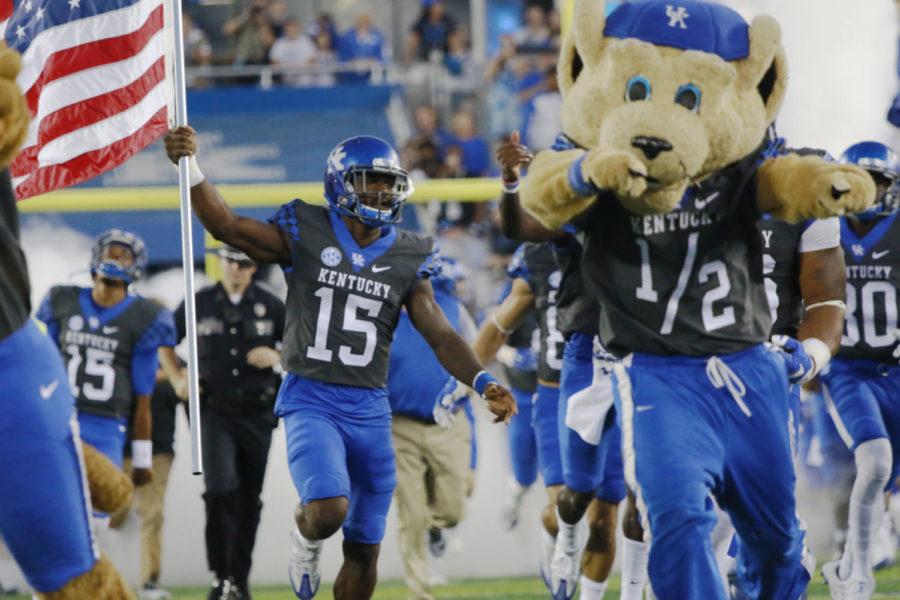 Kentucky+safety+Marcus+McWilson+runs+with+the+American+flag+before+the+Wildcats+game+against+the+South+Carolina+Gamecocks+at+Commonwealth+Stadium+on+September+24%2C+2016+in+Lexington%2C+Kentucky.