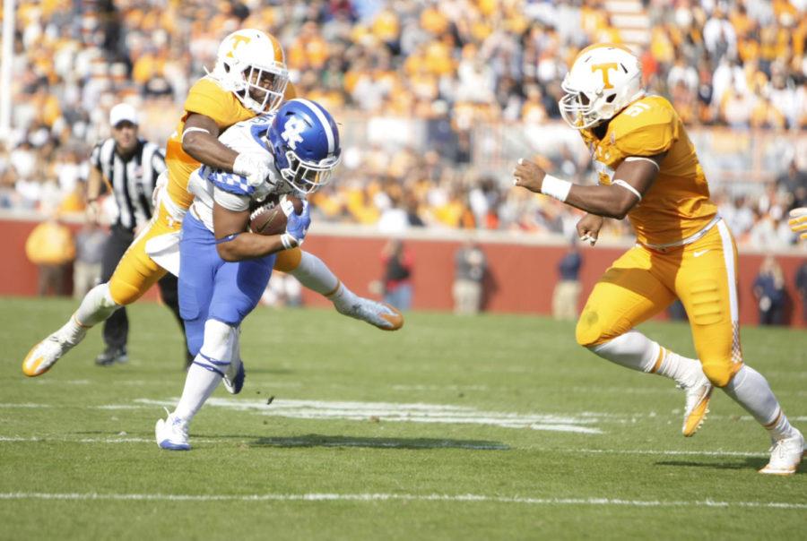 Kentucky running back Benny Snell Jr. carries a defender during the game against Tennessee at Neyland Stadium in Nashville, Ky. on Saturday, November 12, 2016. Photo by Josh Mott | Staff.