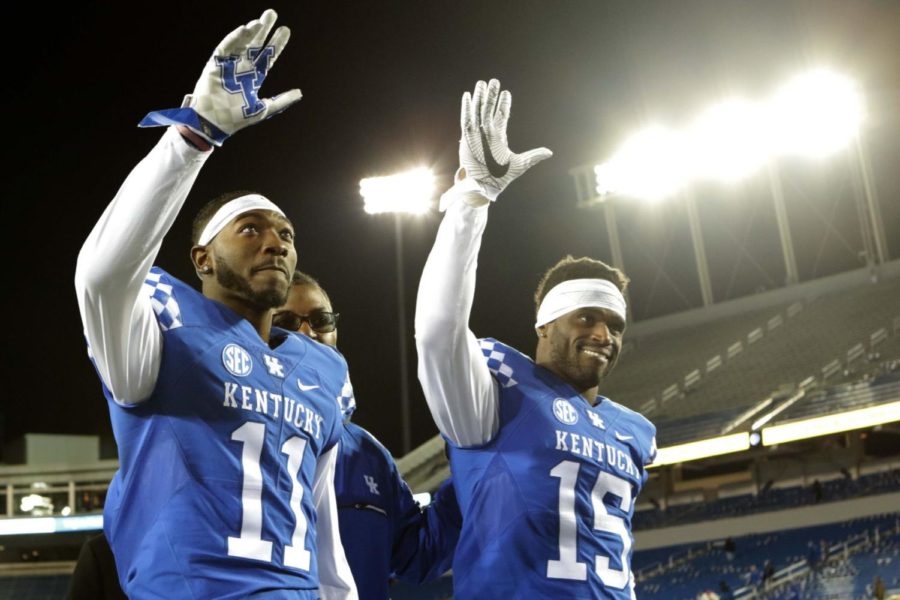 Seniors J.D. Harmon and Marcus McWilson wave to the crowd while walking off the field for the final time after the game against Austin Peay on Saturday, November 19, 2016 in Lexington, Ky. Photo by Hunter Mitchell | Staff