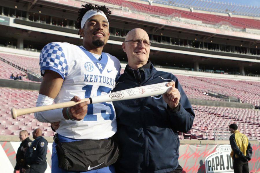 Kentucky quarterback Stephen Johnson receives the MVP award following the game against the Louisville Cardinals on Saturday, November 26, 2016 in Lexington, Ky. Photo by Hunter Mitchell | Staff